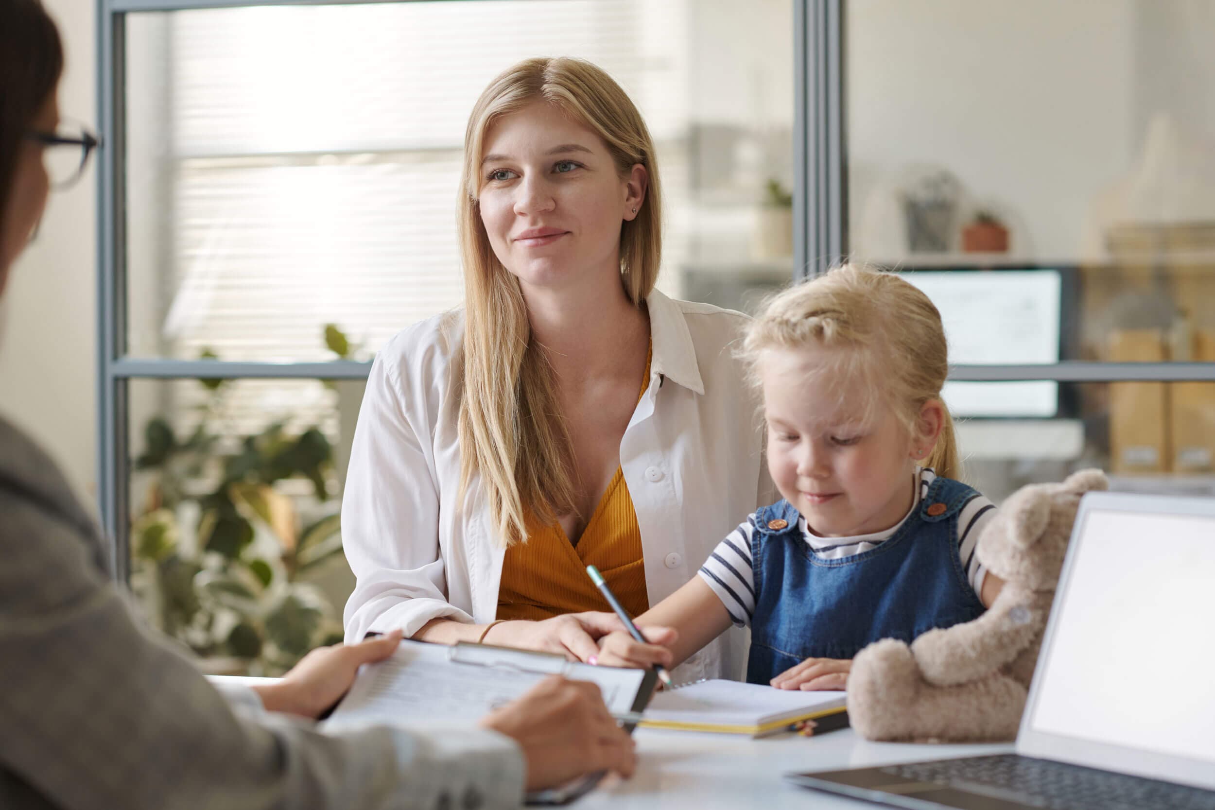 A parent and child meeting with a Peyton’s Learning Place staff member